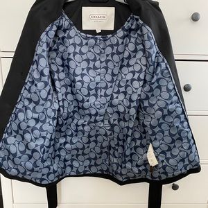 Coach women’s raincoat size S. Logo throughout